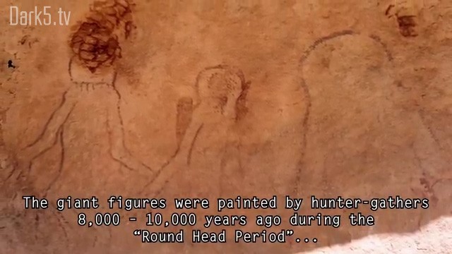 The giant figures were painted by hunter-gatherers 8,000 - 10,000 years ago during the "Round Head Period"...